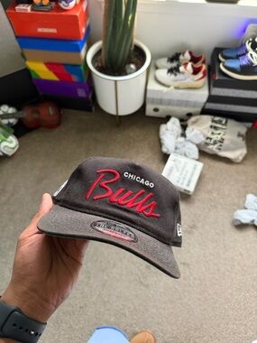 New Era Black Chicago Bulls Snapback Hat with Red Script